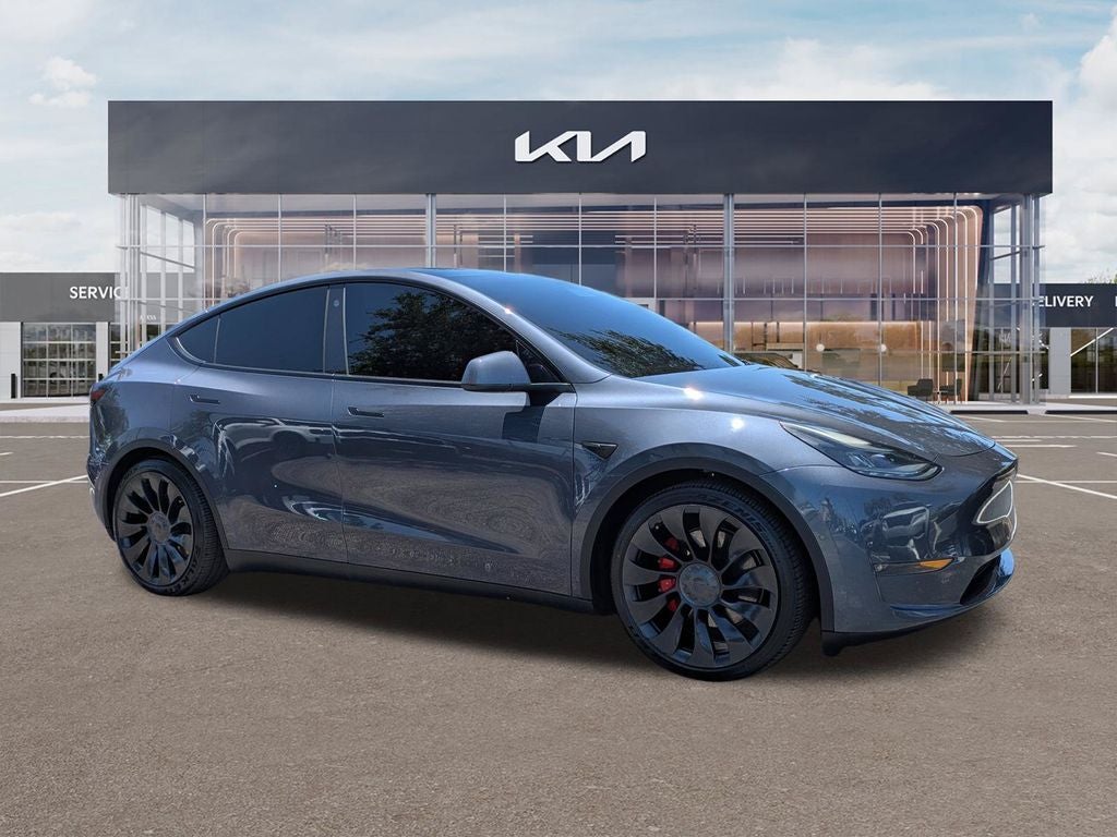2022 Tesla Model Y Performance in Deep Blue Metallic — front three-quarter view