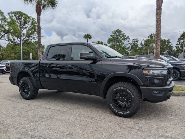 2026 RAM Ram 1500 RAM 1500 REBEL CREW CAB 4X4 5'7' BOX in Diamond Black Crystal Pearl-Coat Exterior Paint — front three-quarter view